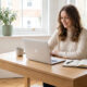 Young UK professional working on laptop planning best side hustles for 2026