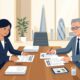 UK Managing Director and Senior HR Director Reviewing Employment Contract and ACAS Dispute Paperwork